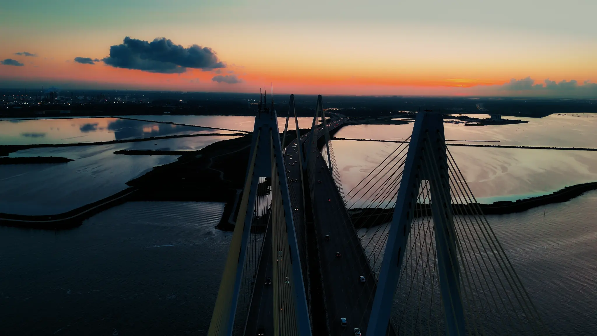 Aerial view down the bridge towers at sunset